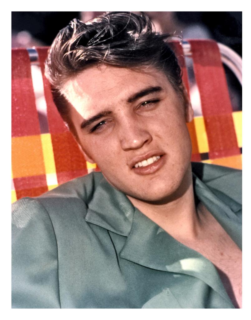 Elvis Presley Smiling on Pool Chair