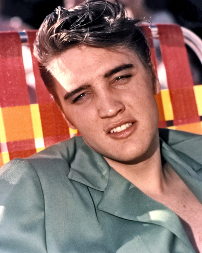 Elvis Presley Smiling on Pool Chair